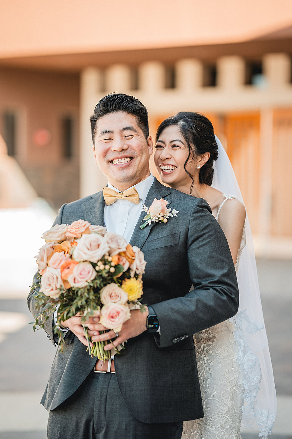 Newly weds hug and laugh shot by Paper Birch Collective, California Wedding Photographer in Orange County