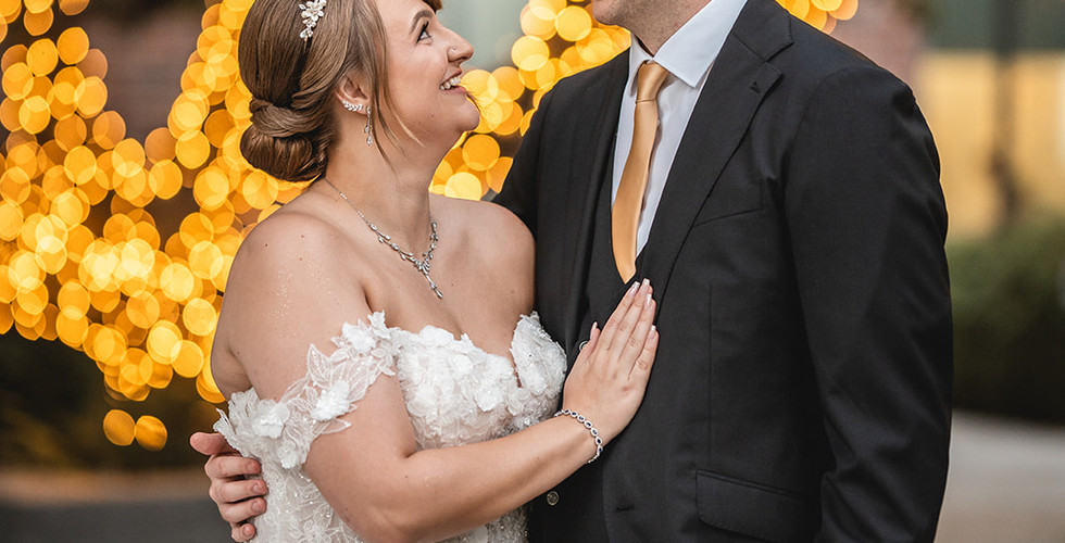Newly weds look at each other during romantic photoshoot shot by Paper Birch Collective, California Wedding Photographer and Videographer Team in Orange County at University Club by Wedgewood Weddings