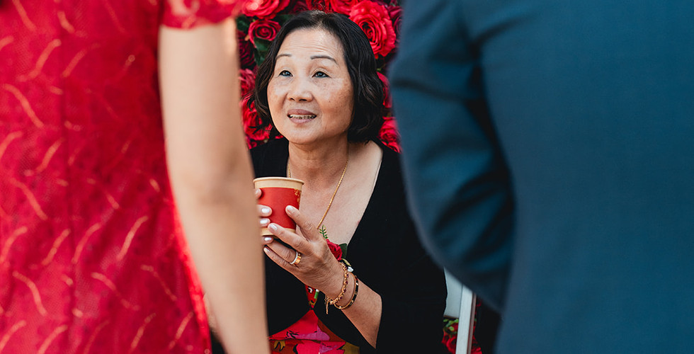 Woman about to drink tea from newly weds at Giracci Vineyards shot by Alvis Pham Photography, Orange County California Wedding Photographer