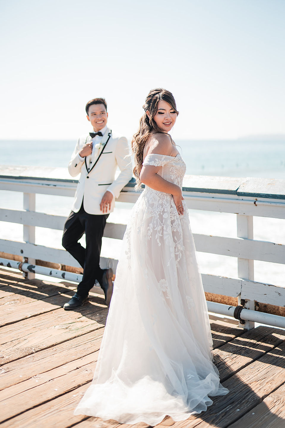 Groom looks at the bride on the pier after their ceremony at Grey Museum shot by Alvis Pham Photography, Orange County California Wedding Photographer