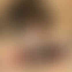 Couple sits on a blanket at Victoria Beach for Proposal shot by Paper Birch Collective, California Wedding Photographer and Videographer Team in Orange County