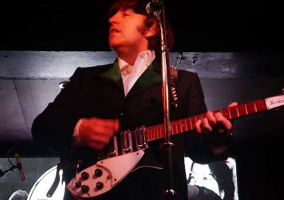 Jimmy Coburn playing electric guitar on stage