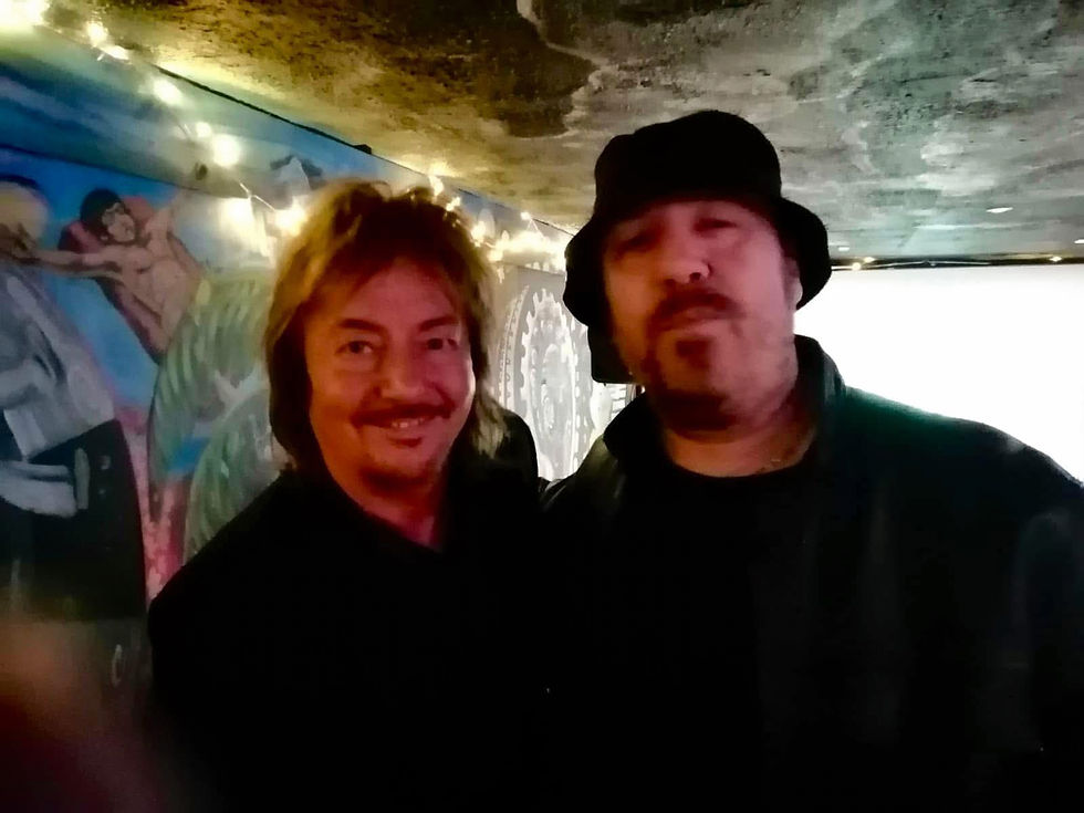 Joe Symes & the Loving Kind posing together indoors.