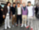 The members of One Direction wearing related clothes from 2011.