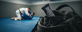 Bag with IMMORTAL energy bar, two men doing martial arts training, Immortal.