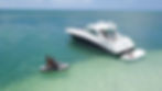 Two women on jet ski near Sea Ray Yacht with SeaLift swim platform installed