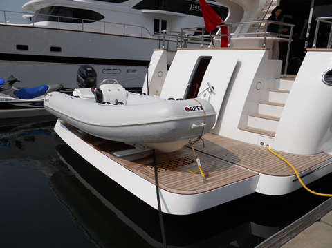 White tender on yacht's swim platform