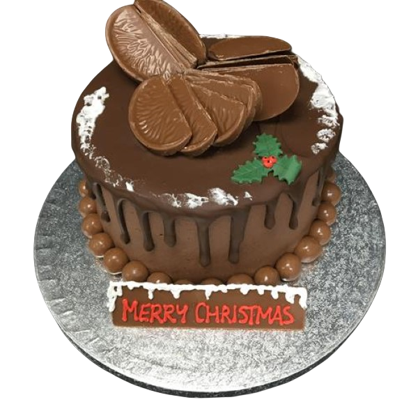 A festive chocolate cake topped with colourful decorations and festive touches, perfect for celebrating Christmas in style.