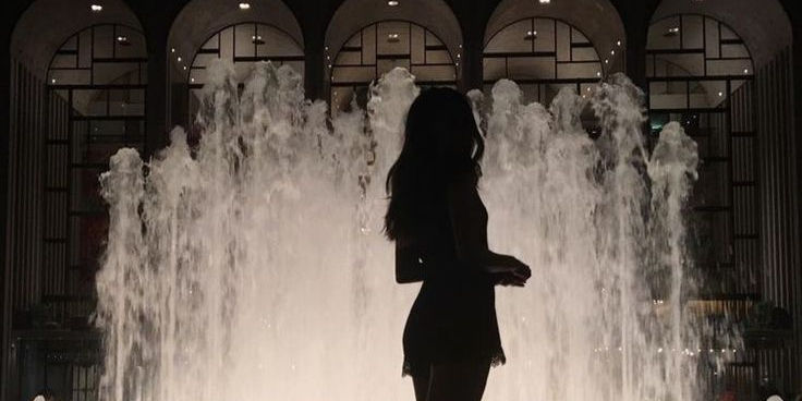 girl in front of a fontain