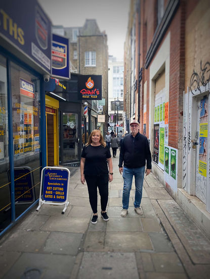 A couple on a London alley