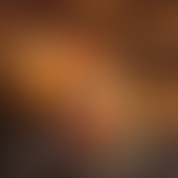 Close-up of chimney cakes filled with strawberries, bananas, and melted chocolate, served on a rusti