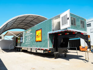 51-foot mobile food bank trailer built by United Food Truck for Forgotten Harvest, featuring full wrap branding and accessibility ramp