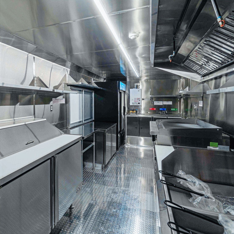 Doc’s Beachology 24-ft mobile kitchen, compact and efficient, designed for speed, efficiency, and safety, industrial-grade cooking, refrigeration, ventilation, plumbing, dedicated generator compartment, extensive refrigeration, storage solutions.