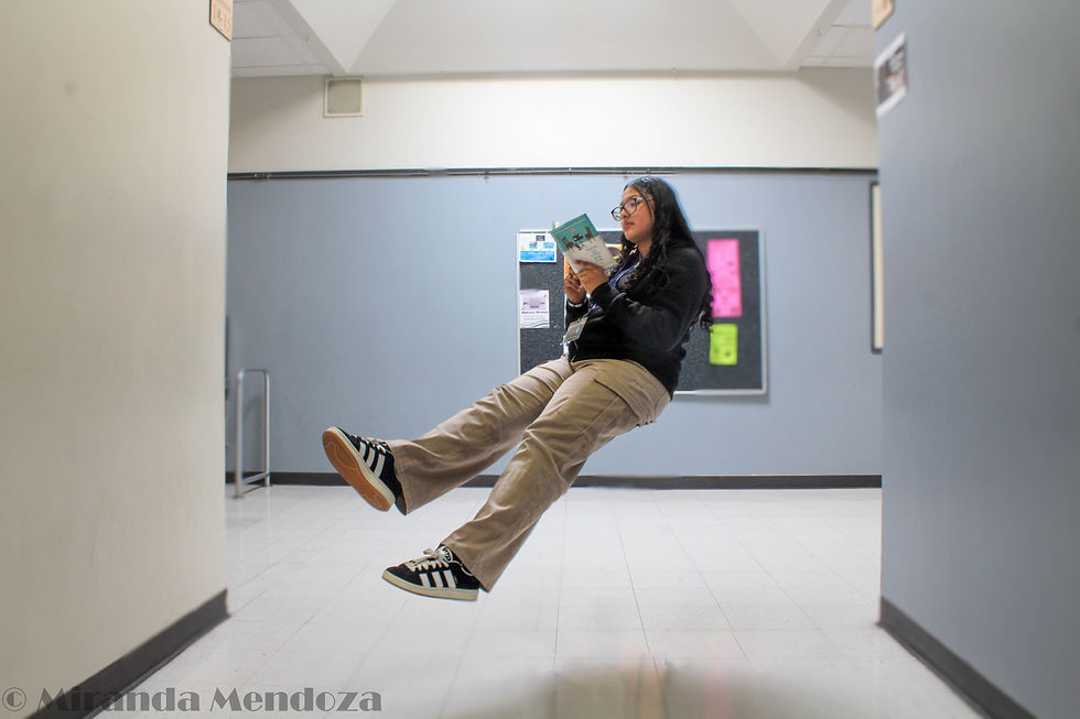 Cristina levitating while reading in the halls of the D building