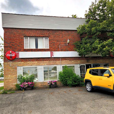 The former Skeen's Grocery building as photographed in August 2023.