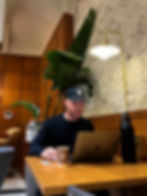 Digital Nomad working from a hotel lounge.