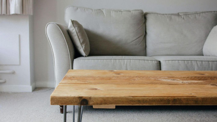 Modern sofa with rug and coffee table in an end of tenancy flat after sofa cleaning by Allsmart Carpet Cleaning