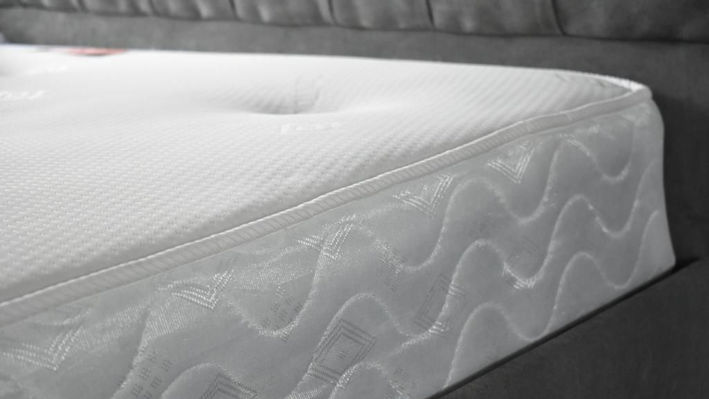 Corner of a bright white cleaned mattress by local company Allsmart Carpet Cleaning