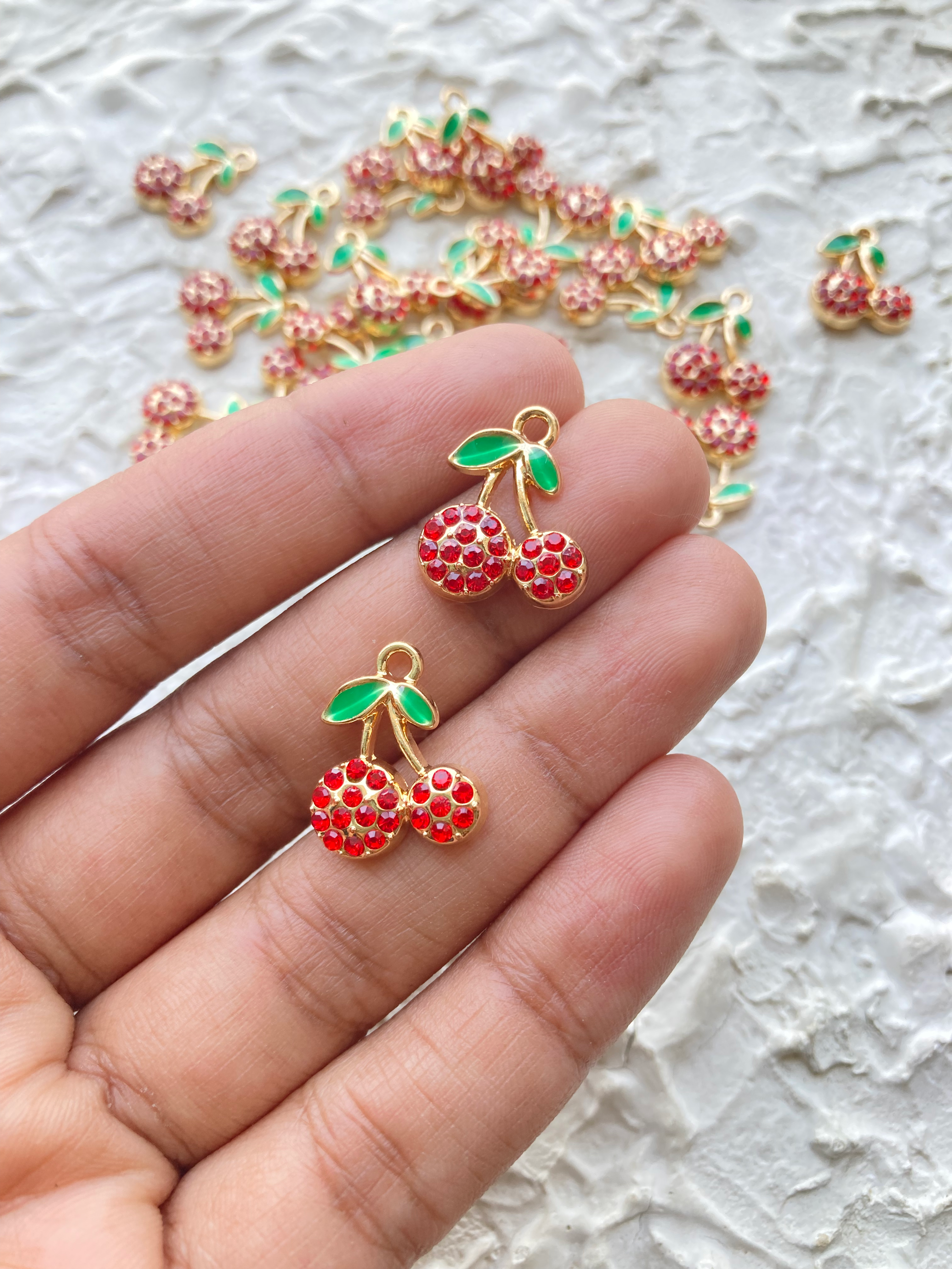 Golden cherry with red rhinestone charm