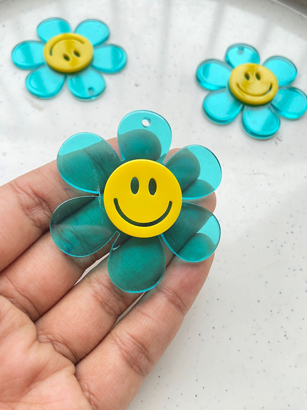 Thumbnail: Big acrylic flower with smiley shape charm
