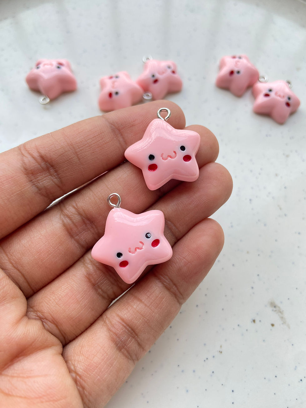 Thumbnail: Colourful star with blush face resin charm