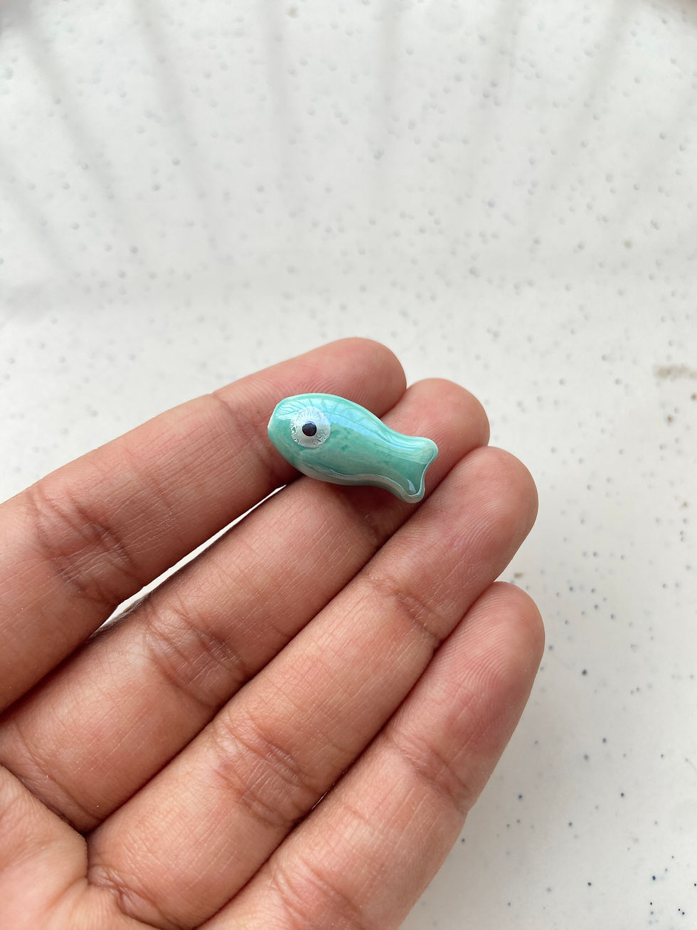 Thumbnail: Porcelain fish bead, vertically drilled