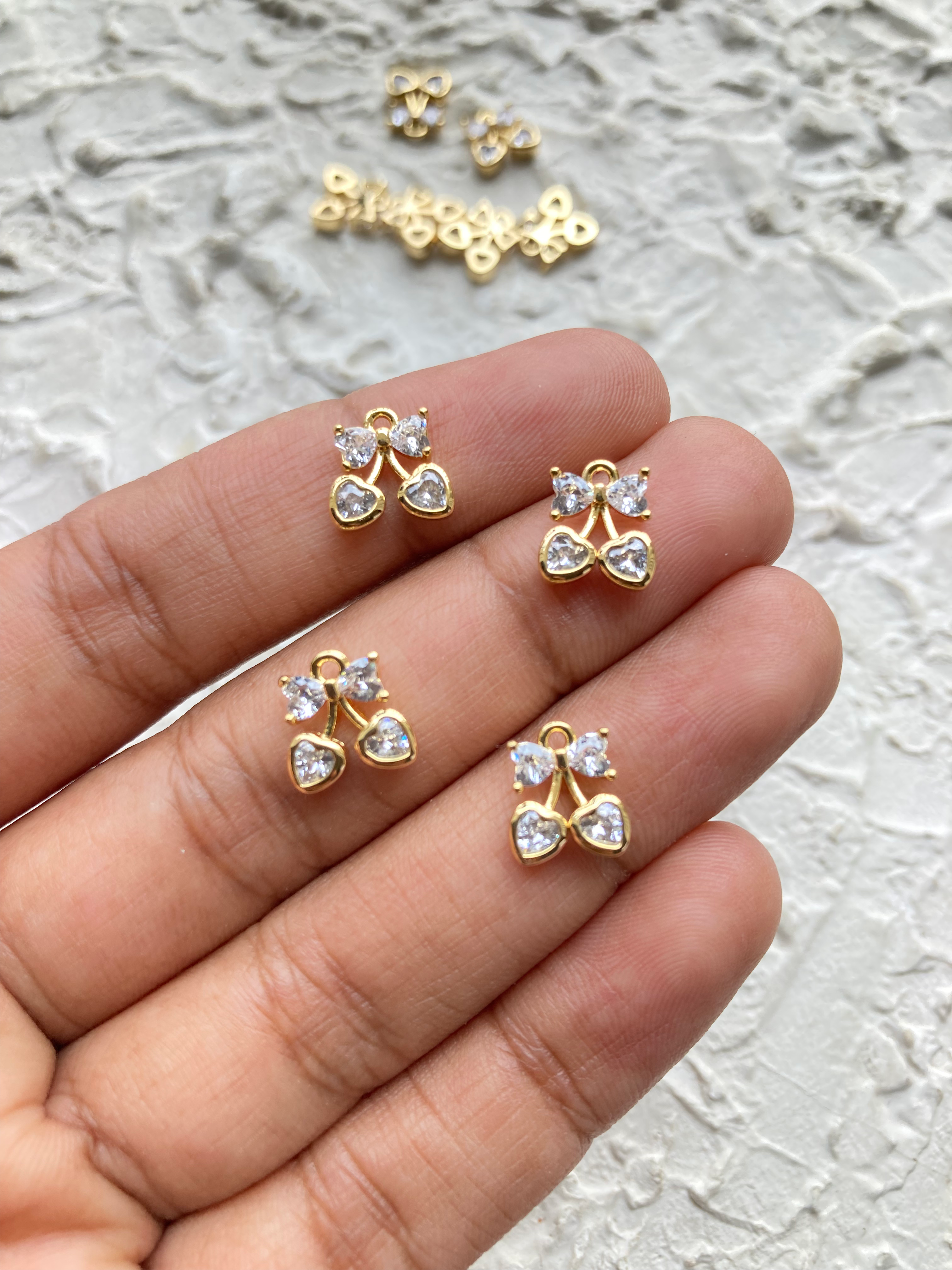 Cubic zirconia bowknot with heart charm