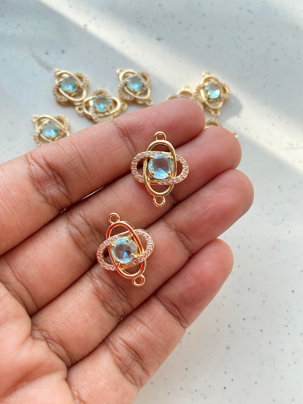 Thumbnail: Zircon round stone with oval rings connector