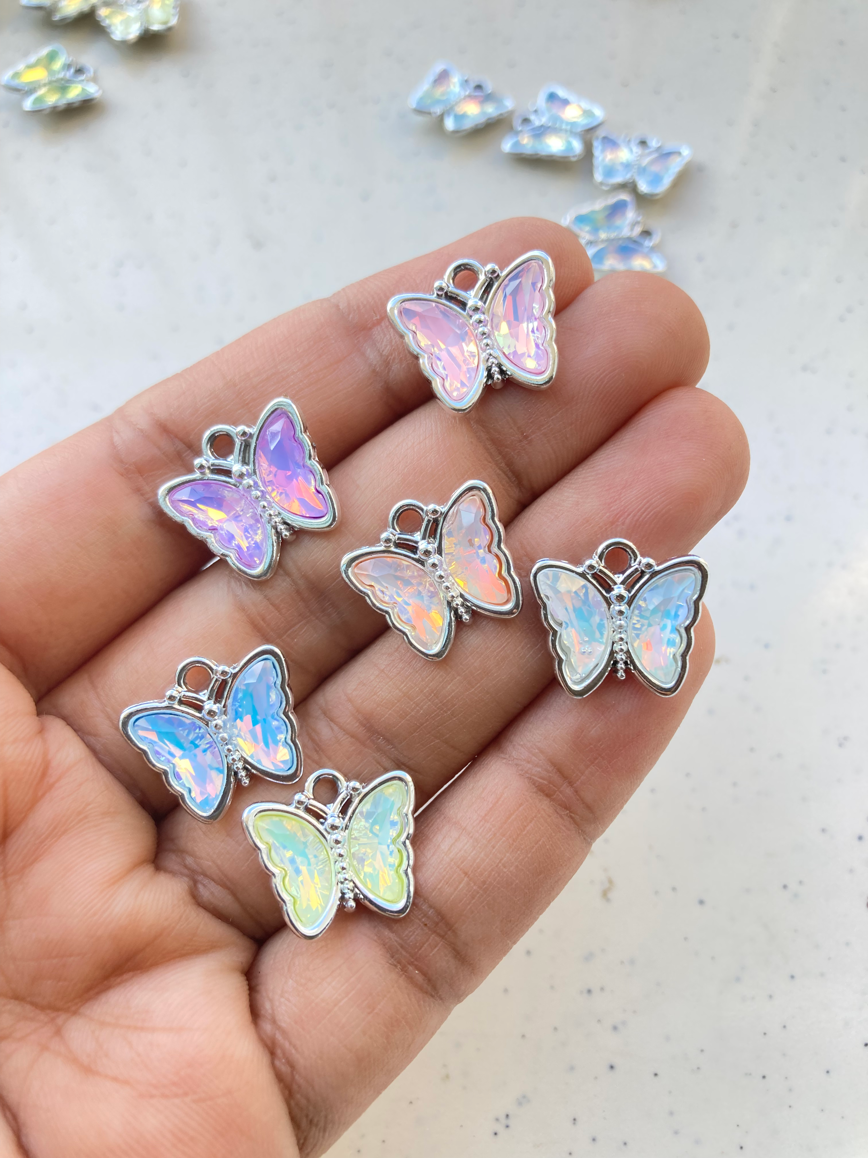Silver alloy butterfly glass charm