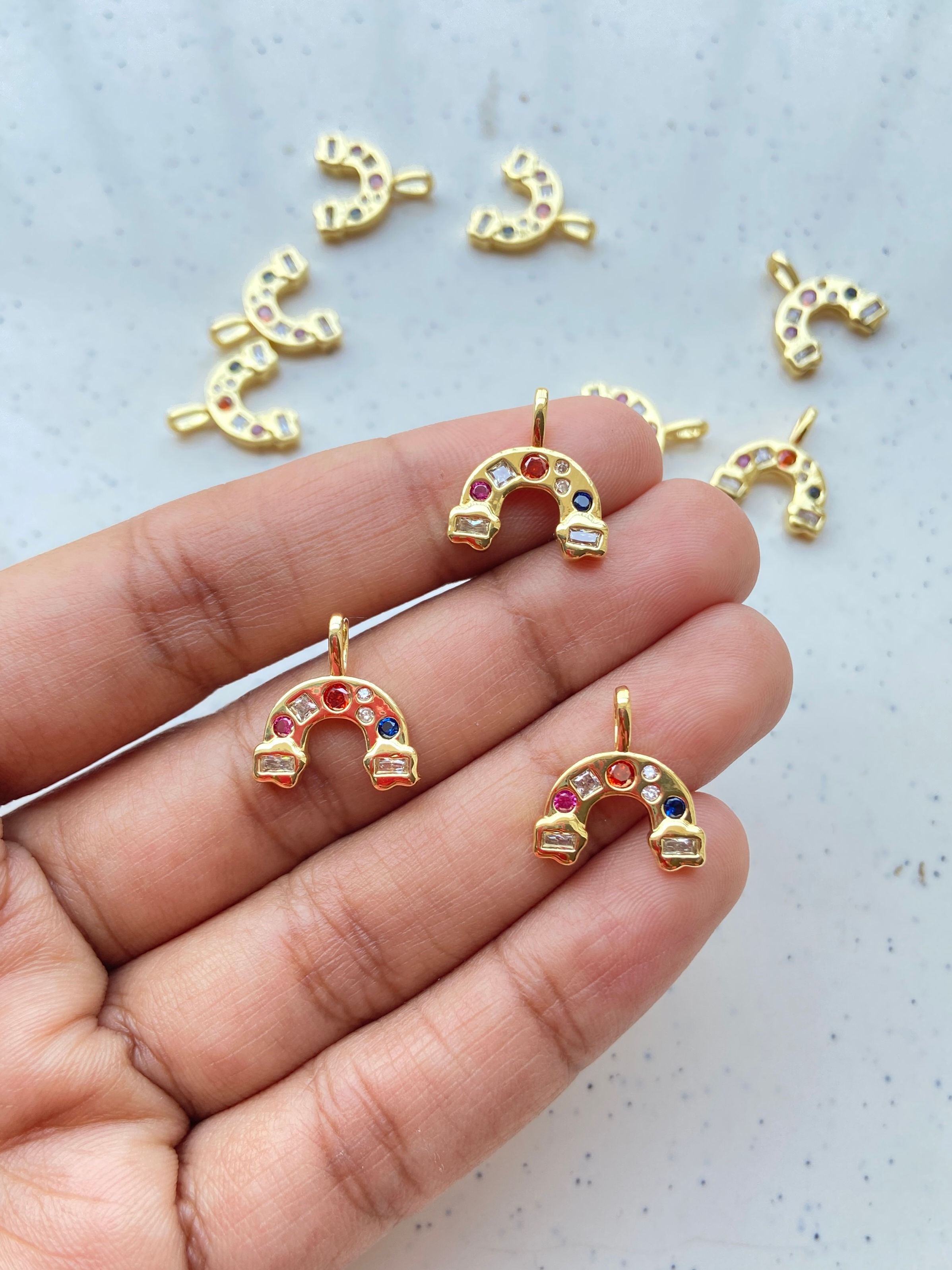 Zircon embedded rainbow charm