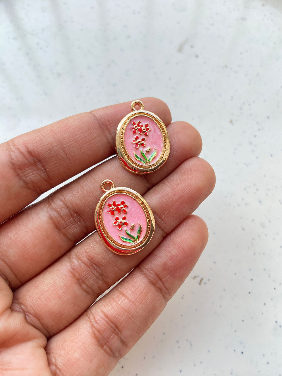 Thumbnail: Enamel oval charm with flower design