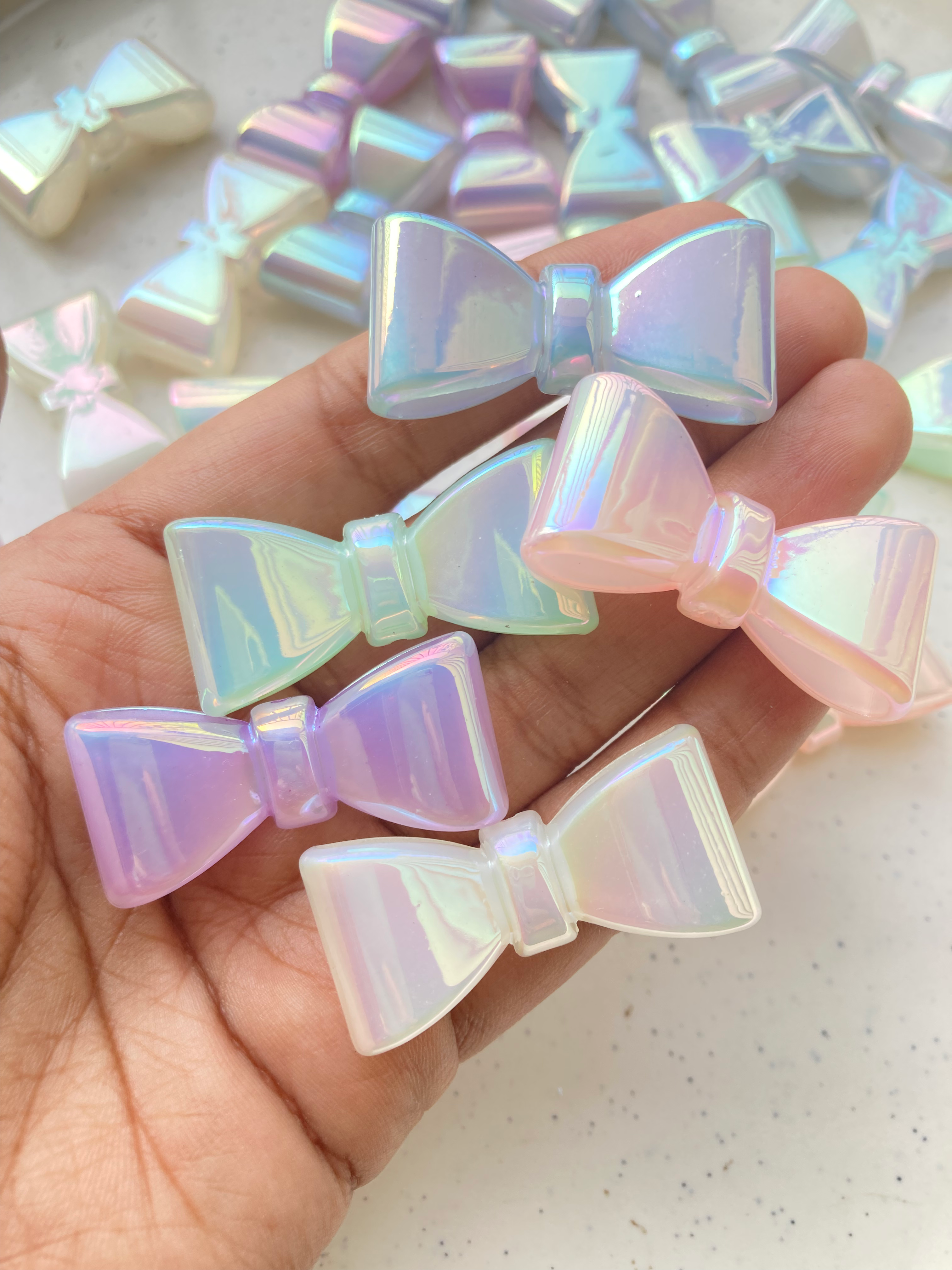 Iridescent bow glow in dark bead