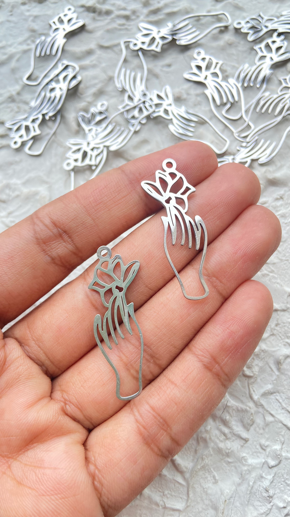 Thumbnail: Stainless steel flower with hand charm