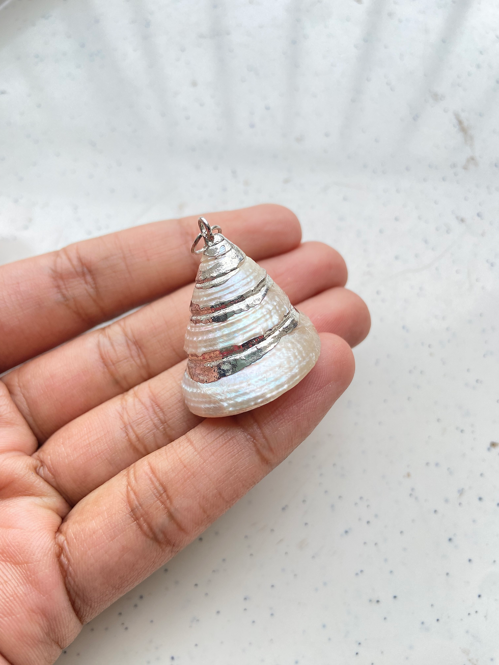 Thumbnail: Silver plating on natural shell charm