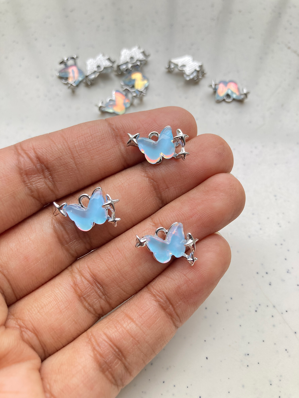 Thumbnail: Holographic silver colour butterfly charm