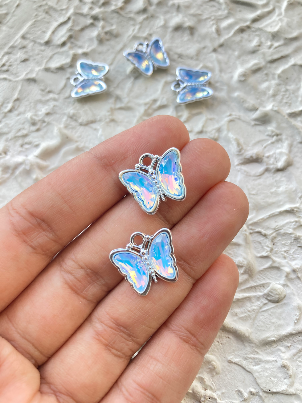 Thumbnail: Silver alloy butterfly glass charm
