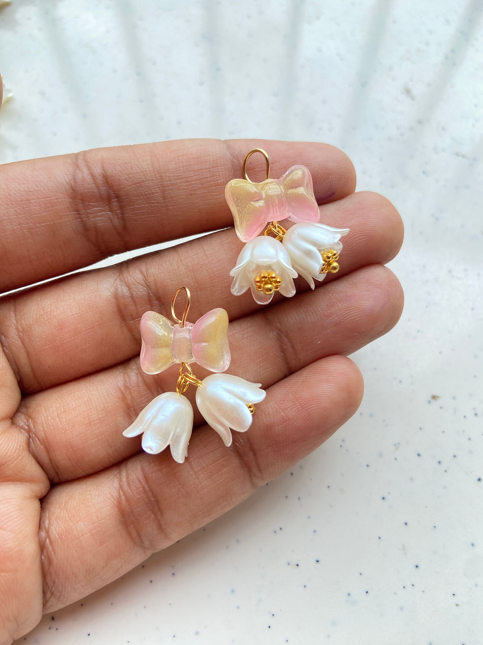 Thumbnail: Bell pattern charm made from flower & bow bead charm