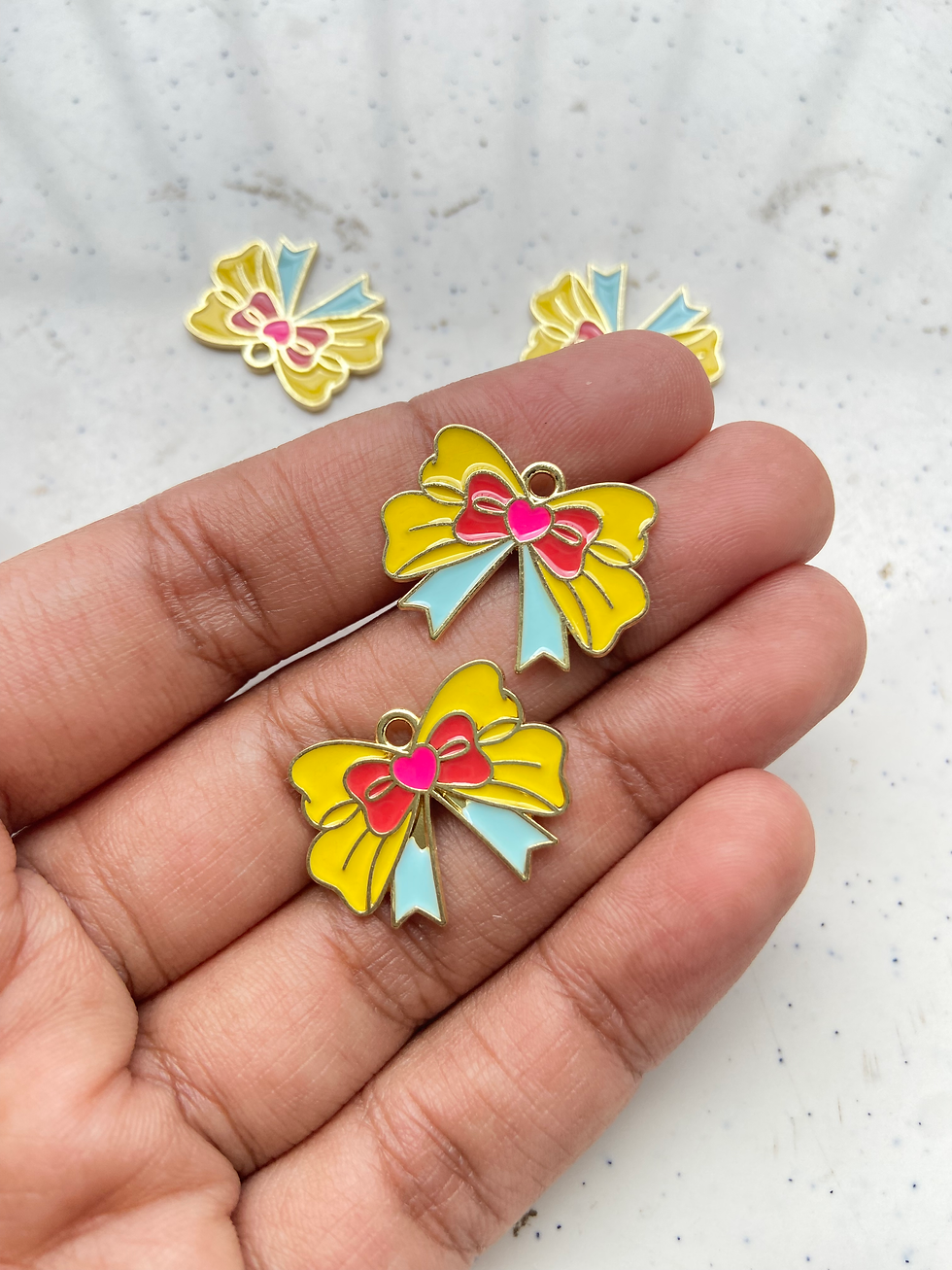Thumbnail: Colourful enamel bow charm