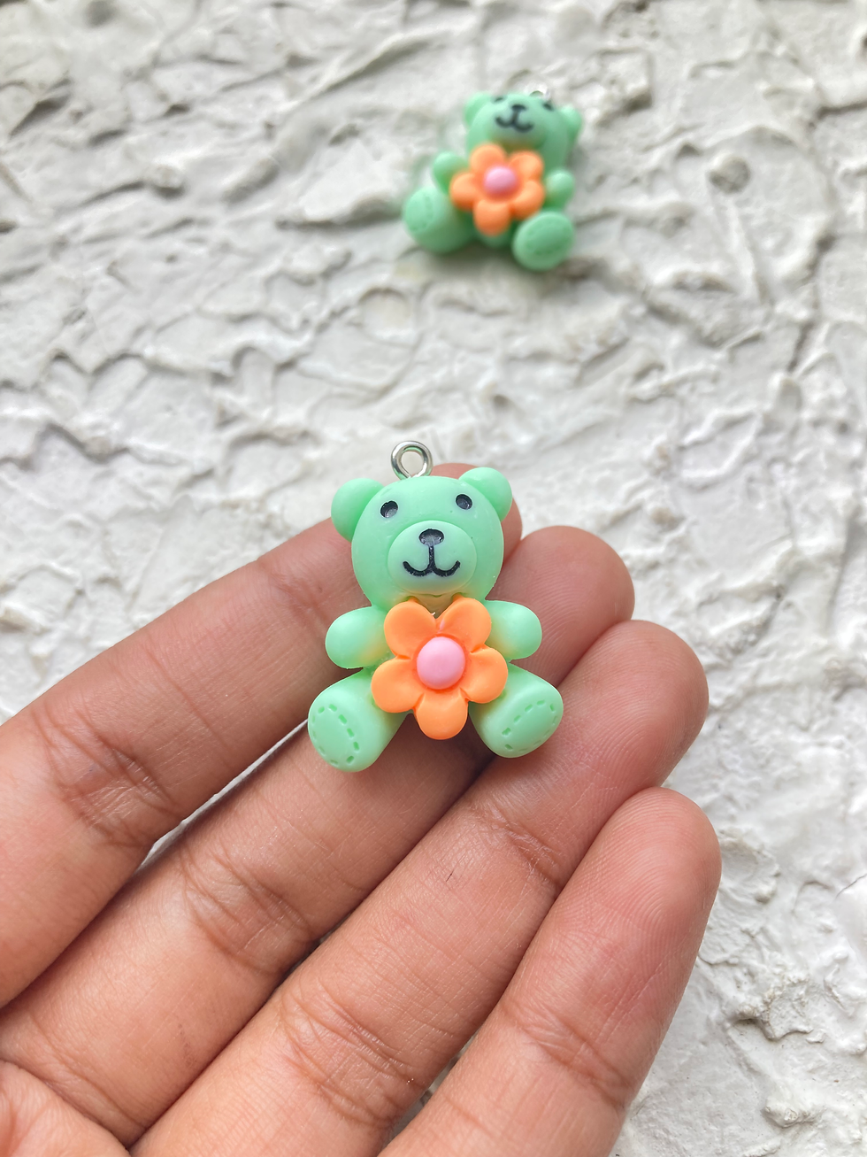 Thumbnail: Resin bear with flower charm