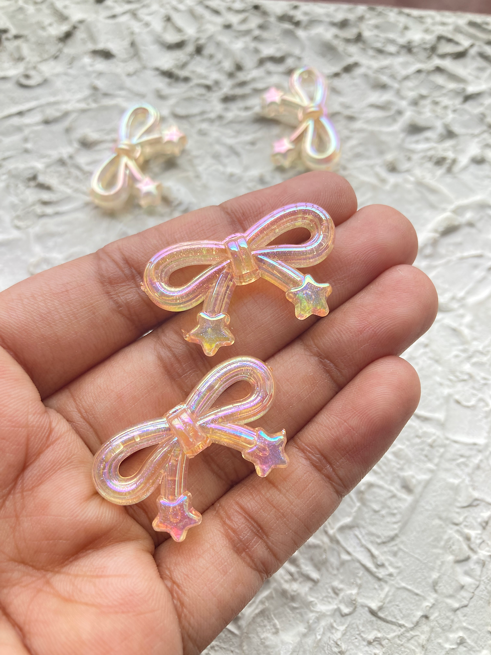 Thumbnail: Shiny bow with star acrylic bead, vertically drilled