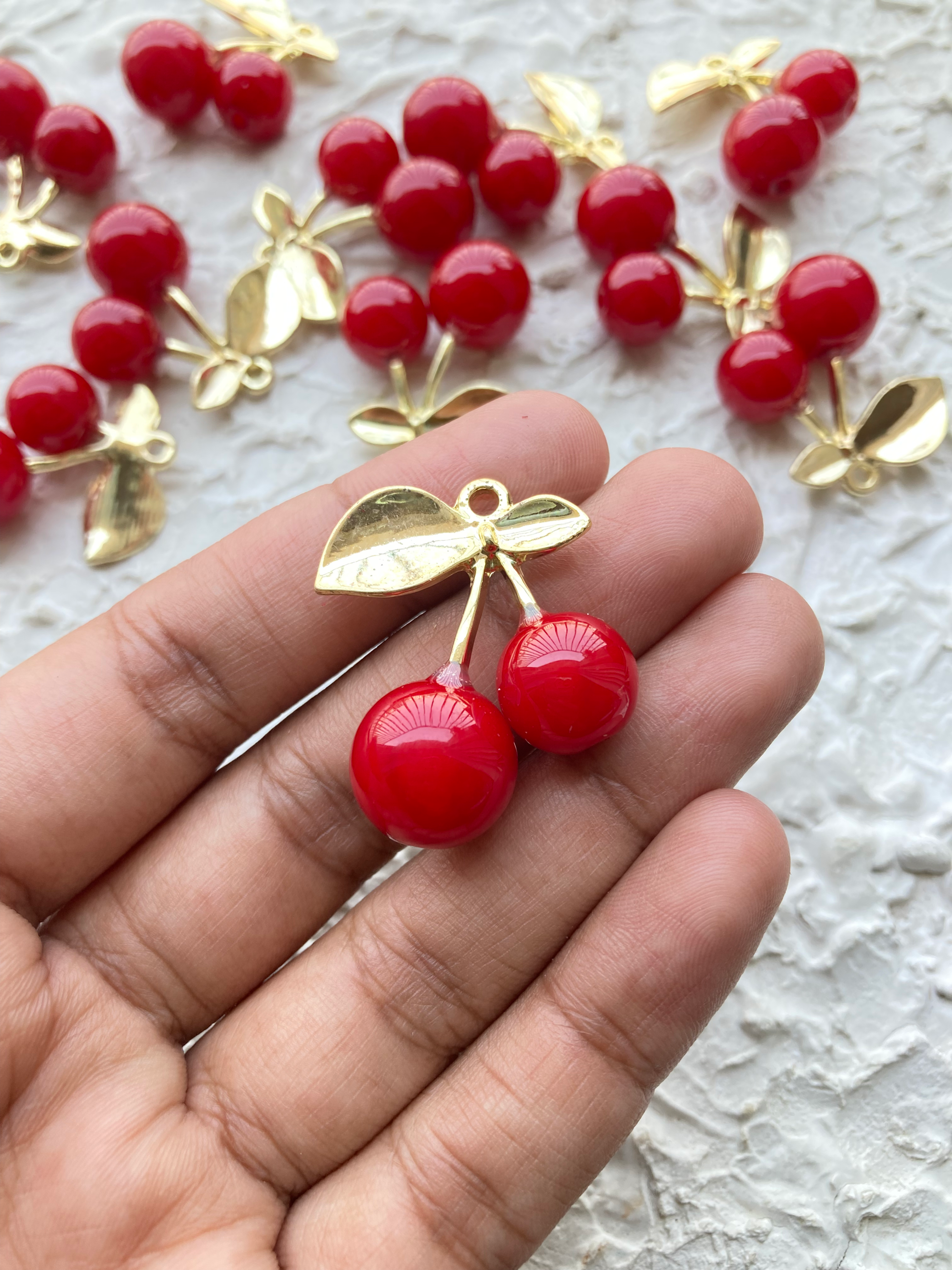 Big resin cherry with brass leaf charm