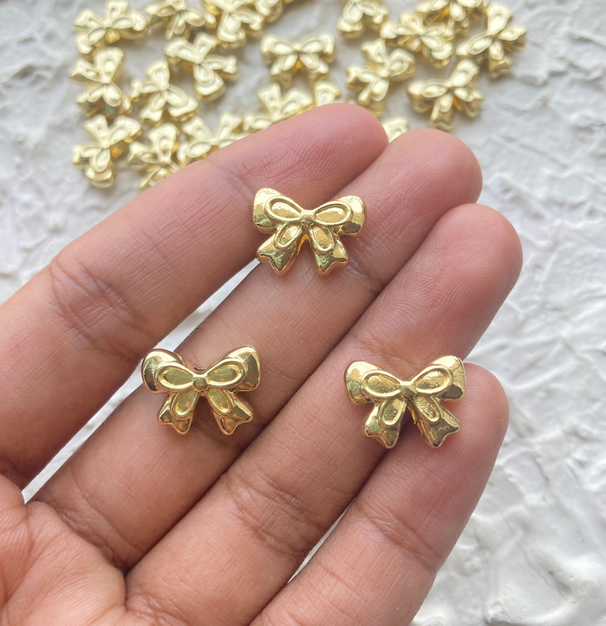 Golden designer bow alloy bead