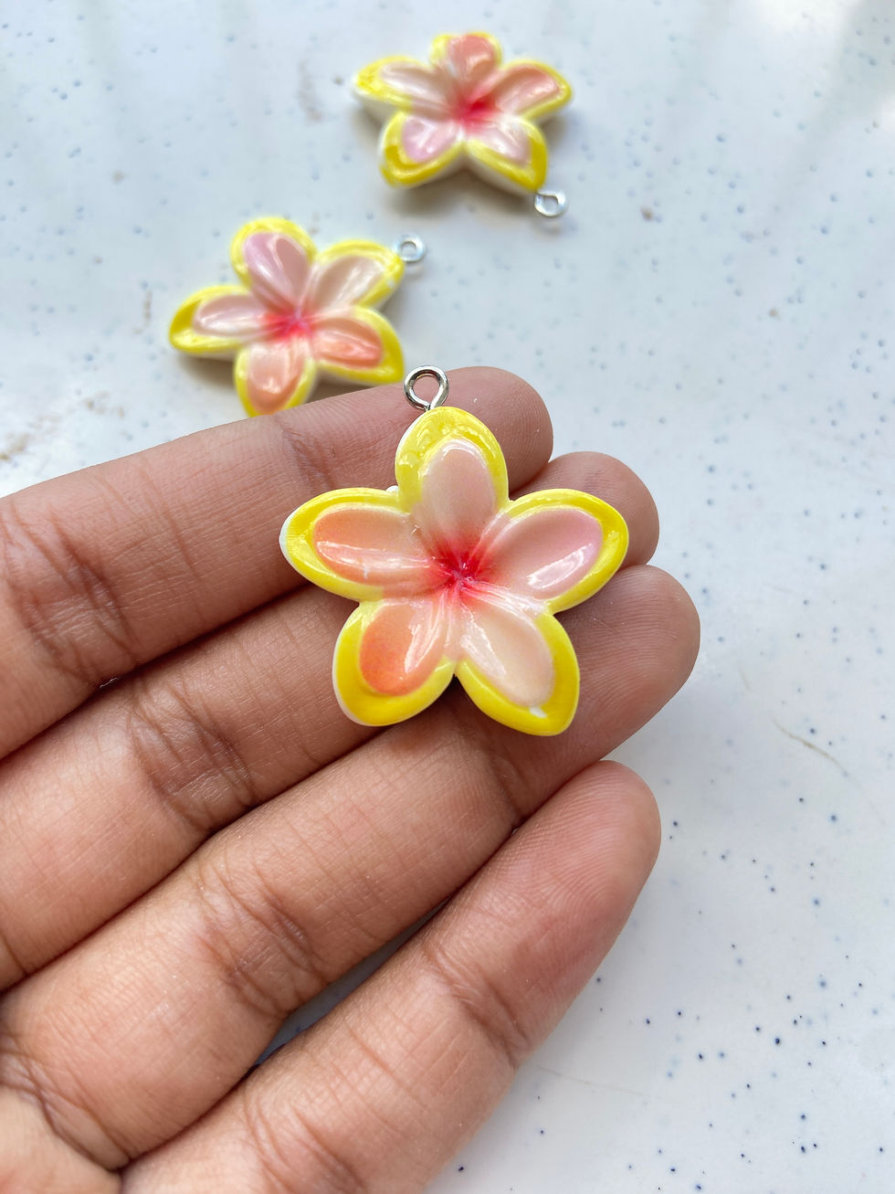 Thumbnail: Double shaded plumeria flower resin charm