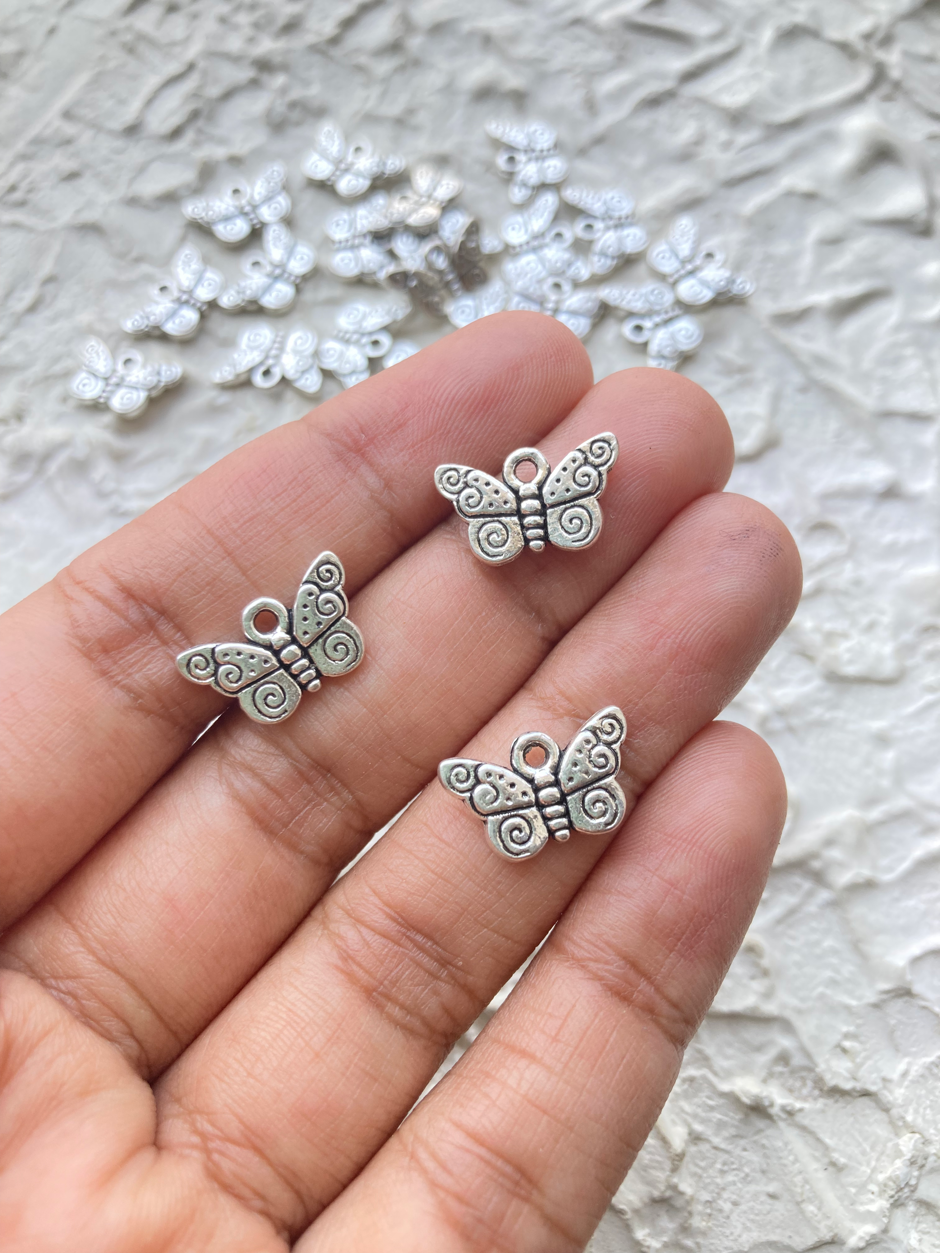 Antique pattern alloy butterfly charm