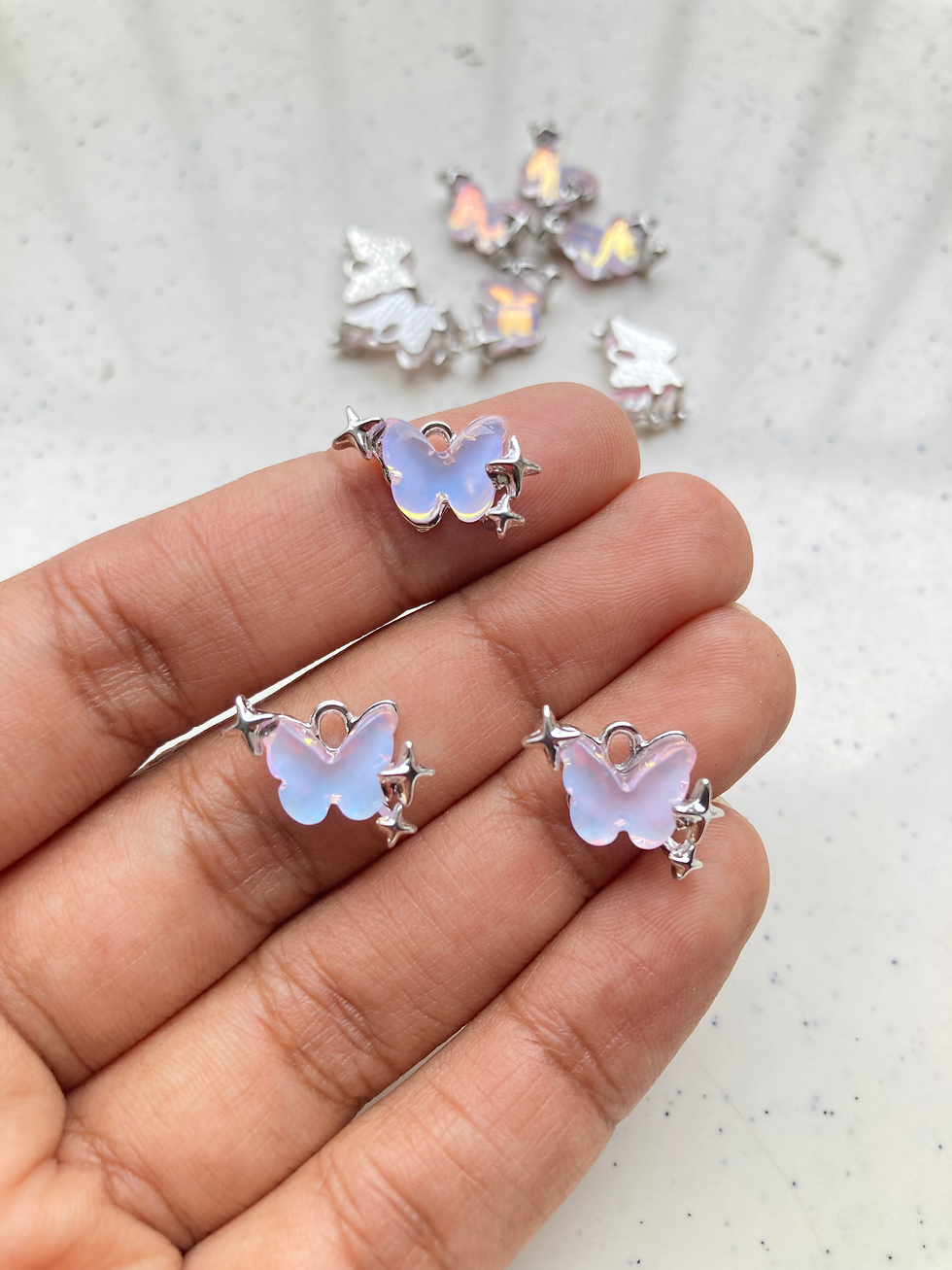 Thumbnail: Holographic silver colour butterfly charm