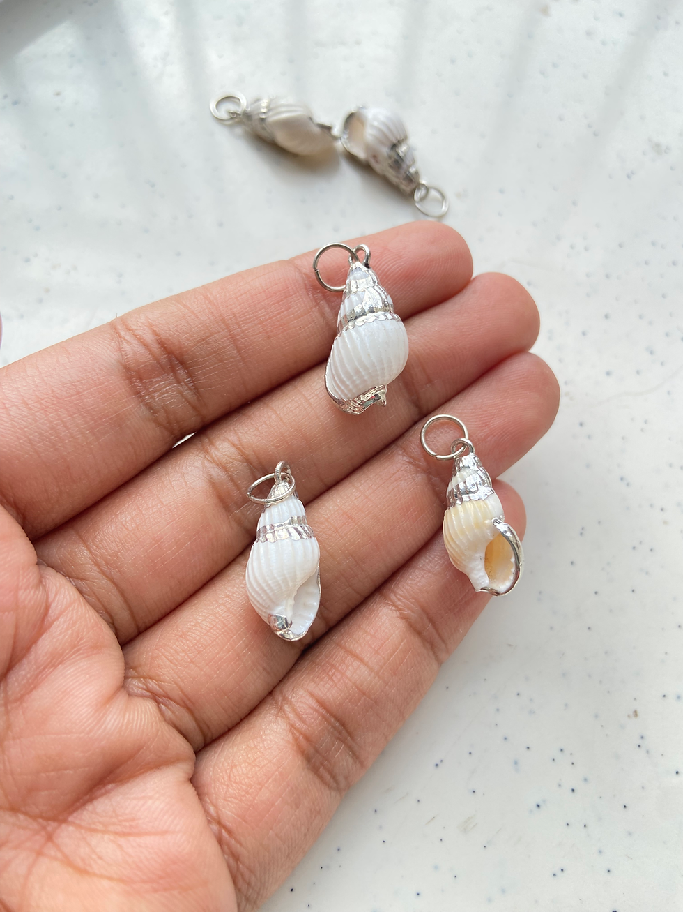 Thumbnail: Silver plating on natural shell charm