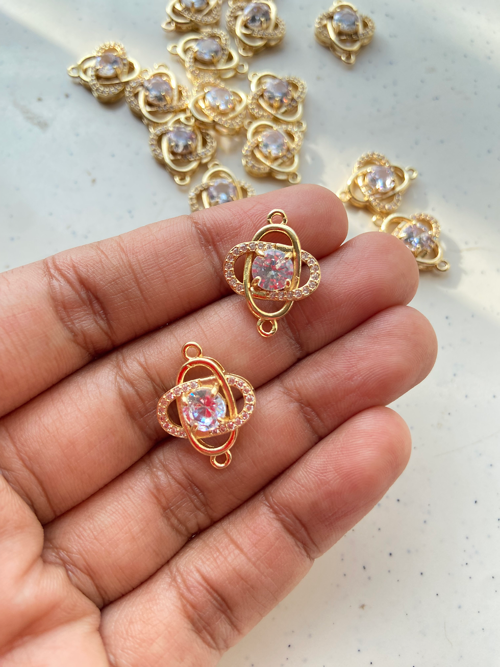 Thumbnail: Zircon round stone with oval rings connector