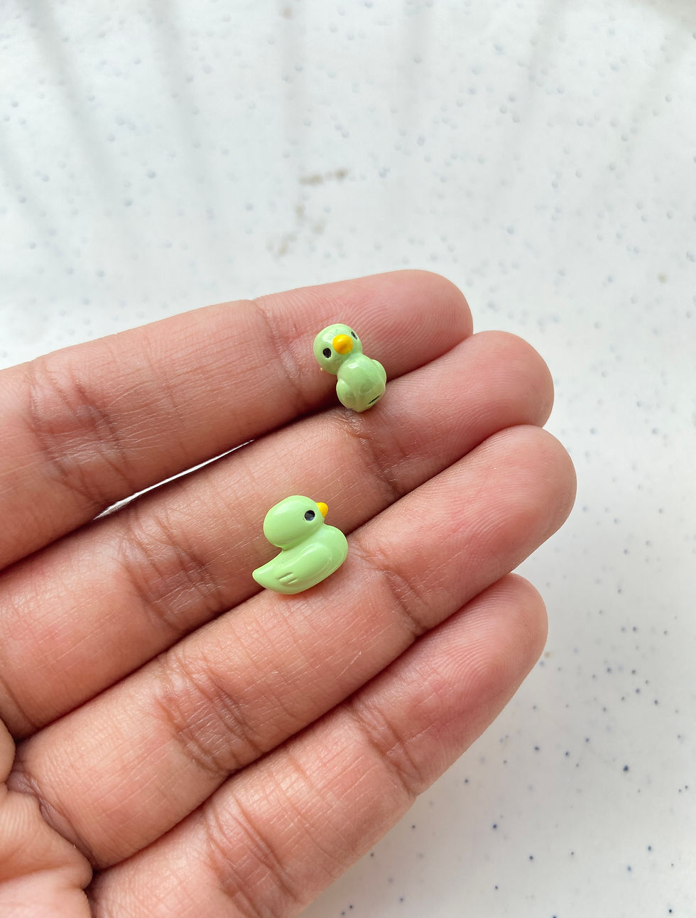 Thumbnail: Spray painted alloy duck bead, vertically drilled