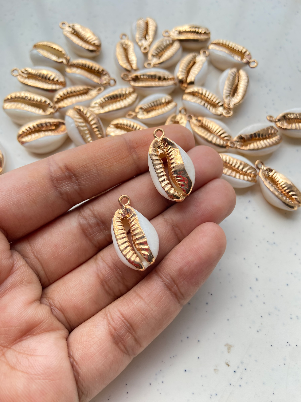 Thumbnail: Electroplated natural cowrie charm