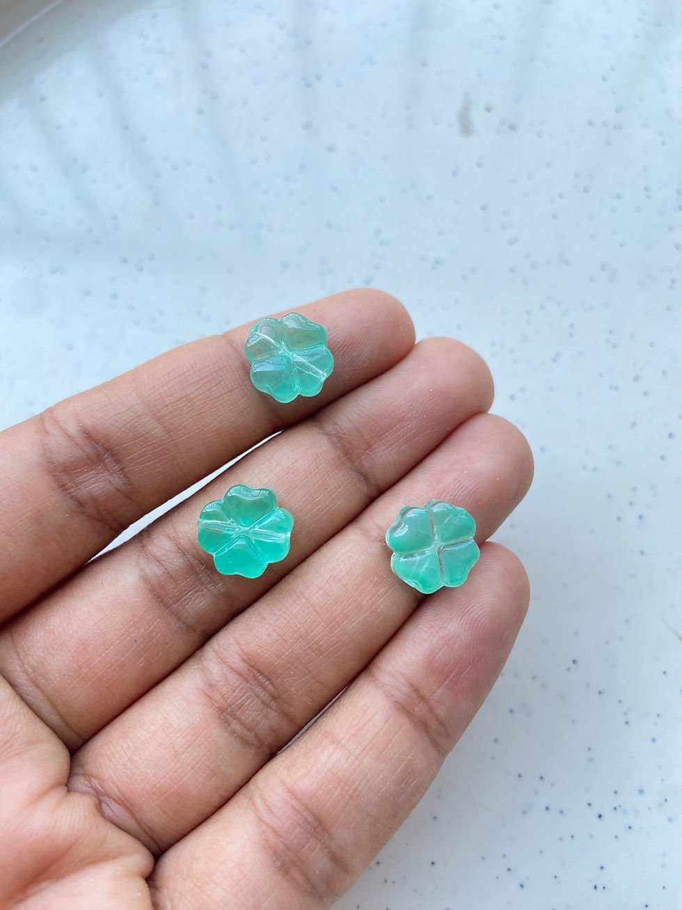 Thumbnail: Glass clover beads, vertically drilled